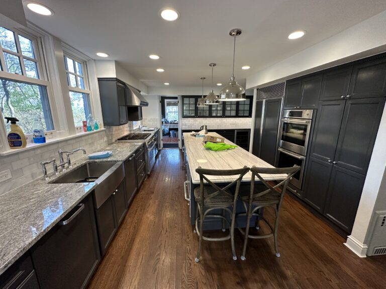 Stunning kitchen transformation after renovation, with state-of-the-art appliances and granite countertops.handyman kitchen renovation