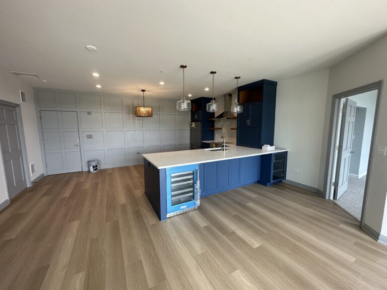 Modern kitchen with an open layout, stylish cabinetry, and a spacious island post-renovation.handyman kitchen renovation